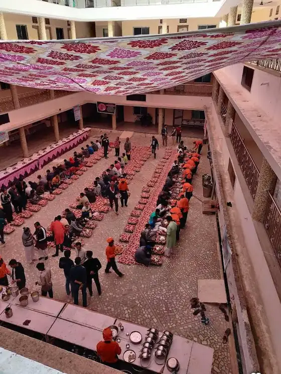 Guests seated in the dining courtyard of the dharamshala