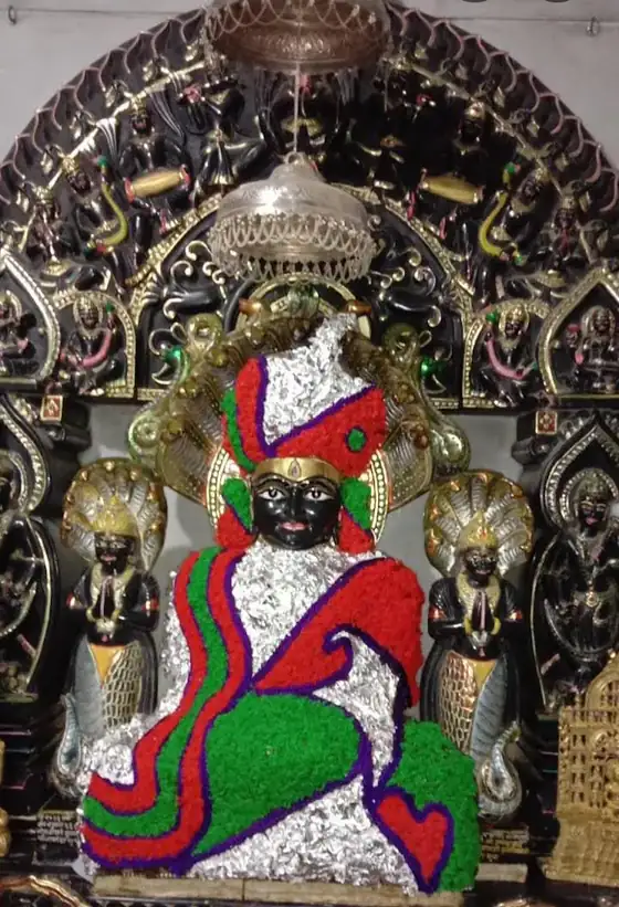 Adorned Jain idol at a temple in the Palitana region